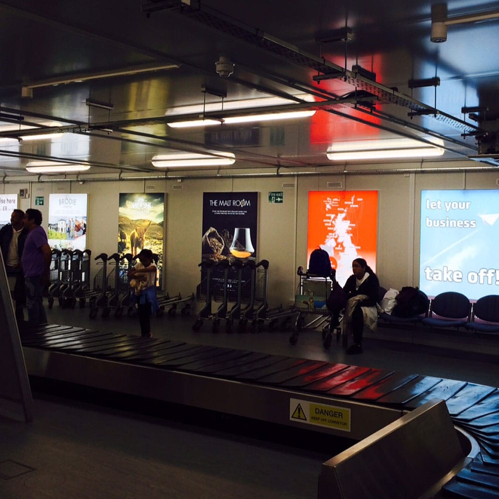 Illuminated 6 sheet, International Baggage Reclaim, Inverness Airport Advertising, HIAL, The Malt Room, Loganair, Tomatin